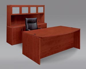 Executive desk, storage lateral file credenza, frosted panel door hutch shown in Cognac Cherry laminate finishe. 