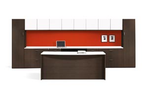Executive office suite consisting of executive desk, kneehole credenza, two drawer lateral files on either side of the credenza, wardrobe/storage cabinets capping the ends with two overhead storage units in between.