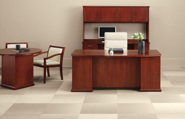 Phoenix's executive suite incorporates the bow front executive desk, kneehole computer credenza, storage hutch with doors and tack board and a round conference table with seating.
