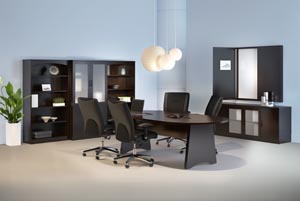 Conference room suite consisting of race track conference table, buffet, conference cabinet with white erase board, two bookcases and a storage bookcase cabinet with frosted panel doors shown in Mocha laminate finish.