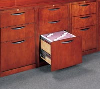 Desks and credenzas in the Chambers series have letter-width file drawers that accommodate both letter and legal filing