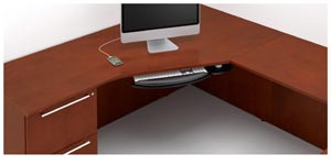 The effect of the Technology Top’s sweeping geometry recognizes user preferences for corner placement of computers.