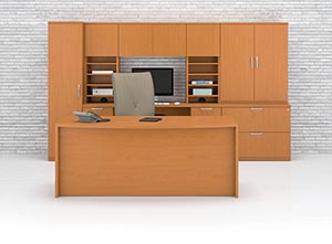 Bow front executive desk with wall unit consisting of a computer credenza, verticle pegion hole storage, overhead door storage cabinet, two drawer lateral file with storage hutch shown in Golden Cherry 