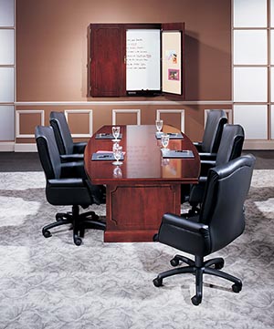 Traditional boat shaped conference table with presentation cabinet. 