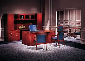 Partner’s Office: Bow Top Executive Desk, Kneespace Credenza, and 48" diameter Executive Round Table, Upper Bookcases, with Personal Cabinet and Single Wardrobe shown in Light Cherry.