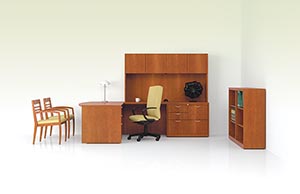 Revival single pedestal desk with bow top, executive height multi-file return and upper bookcase. With open bookcase shown with full pedestal, stepped modesty panel and veneer top in Golden Cherry with Reeded edge and wave pulls in Matte Chrome.