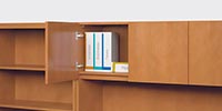 Overhead storage units accommodate standard-height binders.