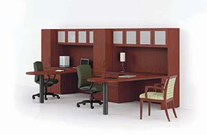 Revolve D-Top Conference Extensions with Credenzas, Personal Cabinets and Upper Bookcases. Shown in Light Cherry laminate with Crescent edge and Bead pulls in Matte Black