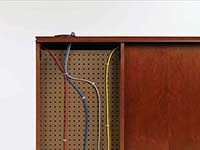 Removable panels on the desk’s approach side conceal wire management capabilities built inside the furniture. Wires route through end panel, top and interior grommets.